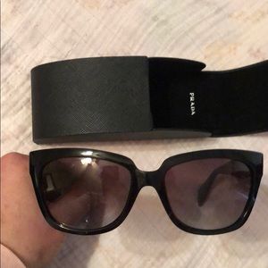 Never worn. PRADA sunglasses POLARIZED with case.